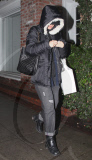 Winona Ryder hides after leaving the hair salon