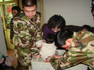 Police, firefighters and repairman free child trapped in washing machine, Xi'an, Shaanxi province, China - 11 Mar 2010
