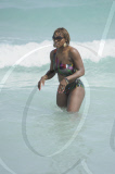 Tennis ace Serena Williams holds court at Miami beach in a colourful swimsuit