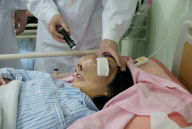 Girl awaits surgery to remove massive tumour distorting her facial features, Lishui, Zhejiang province, China - 06 Apr 2010