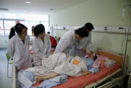 Girl awaits surgery to remove massive tumour distorting her facial features, Lishui, Zhejiang province, China - 06 Apr 2010