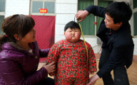 Obese two-year-old weighs as much as adult woman, Taocun town, Shanxi province, China - 06 Apr 2010