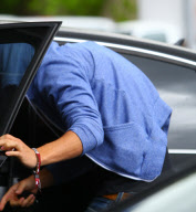 EXCLUSIVE Zac Efron hides while leaving the hospital