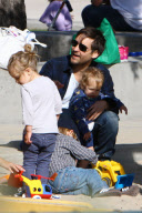 Tobey Maguire and family play at the park