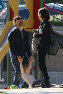 Tobey Maguire and family play at the park