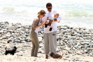 Chris, Ellen, and little Luna Stella soak up the sun asthey walk on the beach in sunny Malibu!!! The family trio, Chris, Ellen, and smiling Stella enjoyed a scenic California coast stroll together with their dogs. 