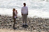 Chris, Ellen, and little Luna Stella soak up the sun asthey walk on the beach in sunny Malibu!!! The family trio, Chris, Ellen, and smiling Stella enjoyed a scenic California coast stroll together with their dogs. 