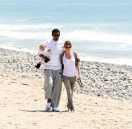 Chris, Ellen, and little Luna Stella soak up the sun asthey walk on the beach in sunny Malibu!!! The family trio, Chris, Ellen, and smiling Stella enjoyed a scenic California coast stroll together with their dogs. 
