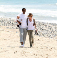 Chris, Ellen, and little Luna Stella soak up the sun asthey walk on the beach in sunny Malibu!!! The family trio, Chris, Ellen, and smiling Stella enjoyed a scenic California coast stroll together with their dogs. 