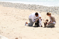Chris, Ellen, and little Luna Stella soak up the sun asthey walk on the beach in sunny Malibu!!! The family trio, Chris, Ellen, and smiling Stella enjoyed a scenic California coast stroll together with their dogs. 