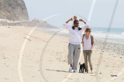 Chris, Ellen, and little Luna Stella soak up the sun asthey walk on the beach in sunny Malibu!!! The family trio, Chris, Ellen, and smiling Stella enjoyed a scenic California coast stroll together with their dogs. 