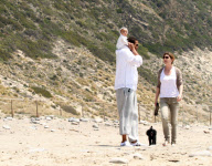 Chris, Ellen, and little Luna Stella soak up the sun asthey walk on the beach in sunny Malibu!!! The family trio, Chris, Ellen, and smiling Stella enjoyed a scenic California coast stroll together with their dogs. 