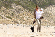 Chris, Ellen, and little Luna Stella soak up the sun asthey walk on the beach in sunny Malibu!!! The family trio, Chris, Ellen, and smiling Stella enjoyed a scenic California coast stroll together with their dogs. 