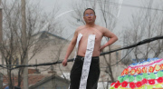 Man protests demolition of home, Changchun, Jilin province, China - 22 Apr 2010