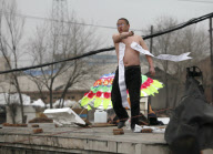 Man protests demolition of home, Changchun, Jilin province, China - 22 Apr 2010