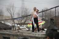 Man protests demolition of home, Changchun, Jilin province, China - 22 Apr 2010