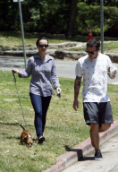 Actress CHRISTINA RICCI shows off her nipples under her gingham shirt while walking her dog with boyfriend CURTIS BUCHANAN