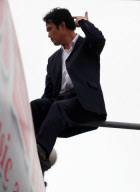 Man threatening suicide dragged to safety by police officers, Kunming, Yunnan province, China - 10 May 2010