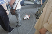 Suspect thief stamps on baby after stopped by police, Zhengzhou, Henan province, China - 24 May 2010