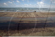 LA: OIL WASHES ASHORE ON GRAND ISLE, LOUISIANA