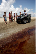 LA: OIL WASHES ASHORE ON GRAND ISLE, LOUISIANA