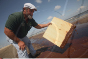 LA: OIL WASHES ASHORE ON GRAND ISLE, LOUISIANA
