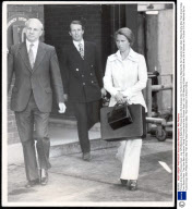Princess Anne Now Princess Royal - July 1975 Wearing A Safari Suit Princess Anne Lifts A Suitcase Into The Boot Of A Car Watched By Her Husband Capt. Mark Phillips Shortly After Their Arrival Today From Boston Mass. They Have Been In America Taking P