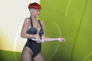 R&B superstar RIHANNA with an odd new ketchup-red hairdo performing in Madrid