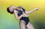 R&B superstar RIHANNA with an odd new ketchup-red hairdo performing in Madrid