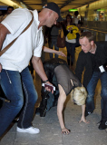MATRIX Lady Gaga falls over at Heathrow airport