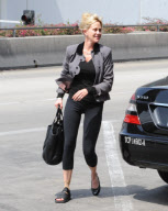 Melanie Griffith Flies Out with Daughter and Dog