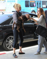 Melanie Griffith Flies Out with Daughter and Dog