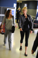 Melanie Griffith Flies Out with Daughter and Dog