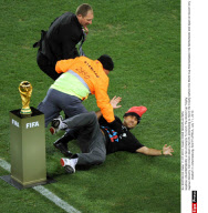 JOHANNESBURG: A Fan Attempts To Fetch The World Cup Trophy