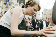  Princess Mathilde listens to a handicapped person complaining about the public traffic, after leaving the Cathedral, Brussels.