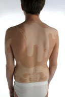 Artist has tan-designs on his body, London, Britain - Jul 2010