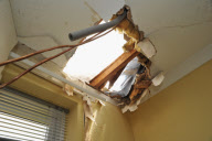 Block of ice possibly from a plane falls through a couple's roof, Chichester, West Sussex, Britain - 22 Jul 2010