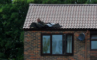 Block of ice possibly from a plane falls through a couple's roof, Chichester, West Sussex, Britain - 22 Jul 2010