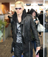 EXCLUSIVE Bleached-blonde Jared Leto with a girl at the airport