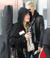 EXCLUSIVE Bleached-blonde Jared Leto with a girl at the airport