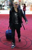 EXCLUSIVE Bleached-blonde Jared Leto with a girl at the airport
