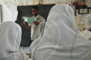 Afghan girls defy Taliban to attend school

