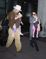 Lisa Marie Presley arrives at Heathrow Airport from Los Angeles with husband and children