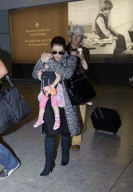 Lisa Marie Presley arrives at Heathrow Airport from Los Angeles with husband and children