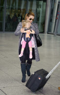 Lisa Marie Presley arrives at Heathrow Airport from Los Angeles with husband and children