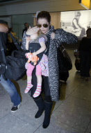 Lisa Marie Presley arrives at Heathrow Airport from Los Angeles with husband and children