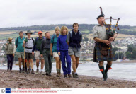 Famous D-Day piper Bill Millin leads a procession on Shaldon Beach, Devon, Britain - 2001