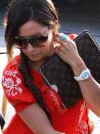 Ashley Tisdale's Louis Vuitton Ipad Accesories Match Perfectly With Her Hairdo