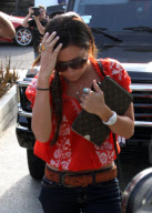 Ashley Tisdale's Louis Vuitton Ipad Accesories Match Perfectly With Her Hairdo