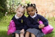 Four-year-old black and white twins Marcia and Millie Biggs enjoy their first day at school, Birmingham, West Midlands, Britain - 12 Sep 2010
